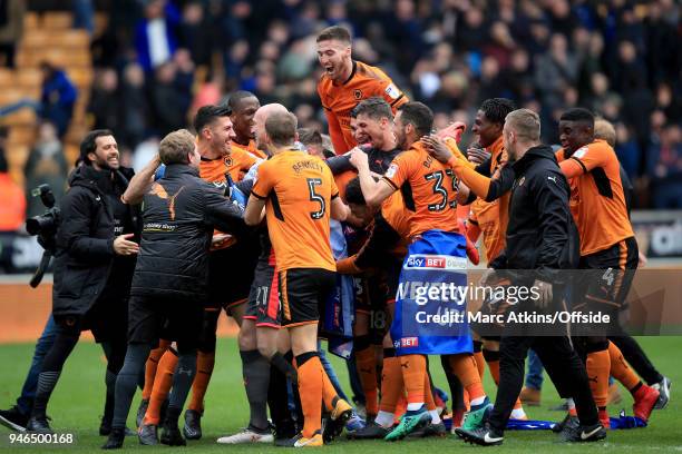 Wolves players celebrate promotion during the Sky Bet Championship match between Wolverhampton Wanderers and Birmingham City at Molineux on April 15,...