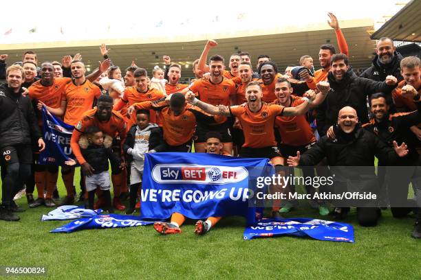 Wolves players celebrate promotion during the Sky Bet Championship match between Wolverhampton Wanderers and Birmingham City at Molineux on April 15,...