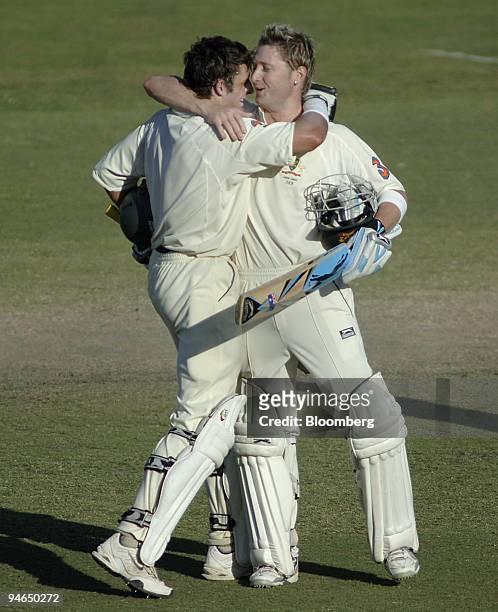 Australia's Michael Hussey, left, and Michael Clarke celebrate after claiming victory over England by 6 wickets on day 5 of the second Ashes Test...