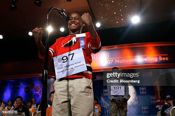 Kennyi Aouad of Terre Haute, Indiana, reacts after correctly spelling a word during Round 4 of the 2007 Scripps National Spelling Bee in Washington,...