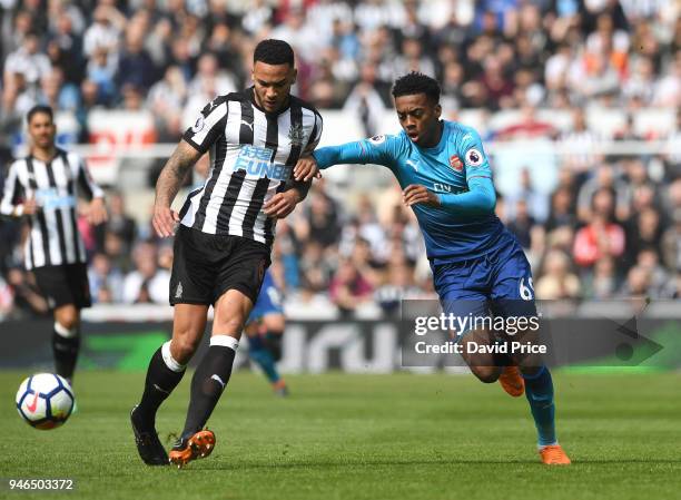 Joe Willock of Arsenal closes down Jamaal Lascelles of Newcastle during the Premier League match between Newcastle United and Arsenal at St. James...
