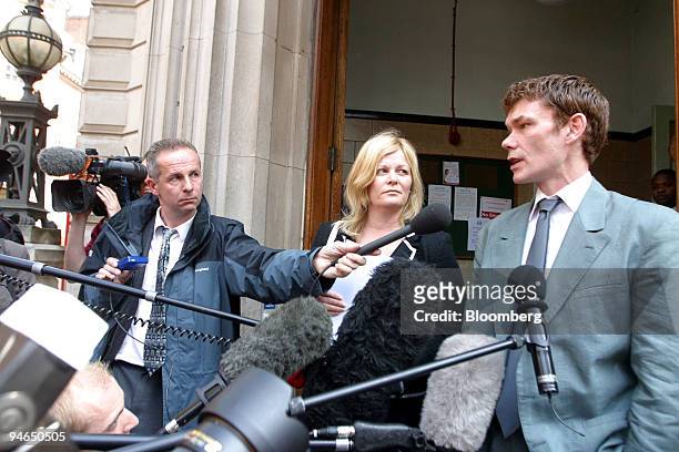 Gary McKinnon, right, speaks after a hearing at Bow Street Magistrates Court in London, Wednesday, May 10, 2006. The court decided McKinnon should be...