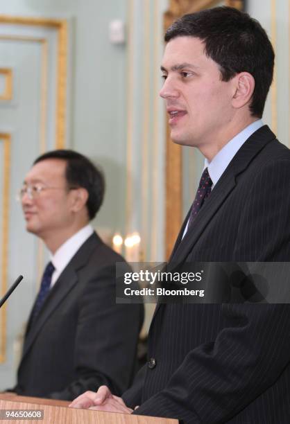 Yang Jiechi, the Chinese foreign minister, listens as David Miliband, right, the U.K. Foreign secretary, speaks during a press conference at Carlton...