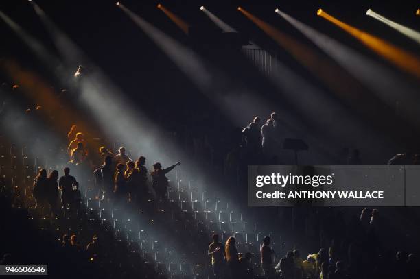 Smoke settles on the stands as people leave their seats after watching the closing ceremony of the 2018 Gold Coast Commonwealth Games at the Carrara...