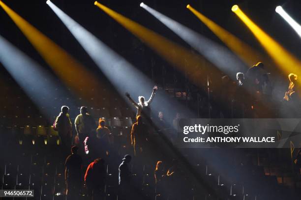 Smoke settles on the stands as people leave their seats after watching the closing ceremony of the 2018 Gold Coast Commonwealth Games at the Carrara...