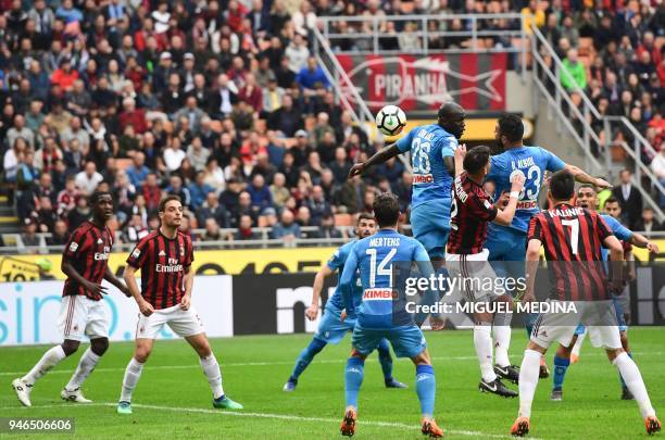 Napoli's French defender Kalidou Koulibaly vies with AC Milan's Argentinian defender Mateo Musacchio during the Italian Serie A football match AC...