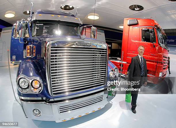 Freightliner truck and a Mercedes-Benz truck are on display at the DaimlerChrysler stand at the IAA Commercial Vehicles Show in Hanover, Germany, on...