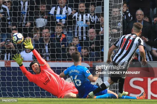 Newcastle United's Scottish midfielder Matt Ritchie scores their second goal past Arsenal's Czech goalkeeper Petr Cech during the English Premier...