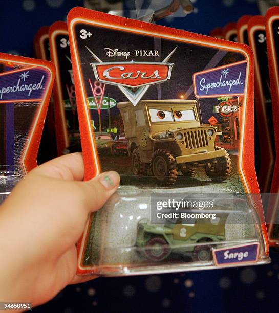 Child holds a package containing one of the recalled "Sarge" toys at a store in Willowbrook, Illinois, Tuesday, Aug.14, 2007. China's claim that...