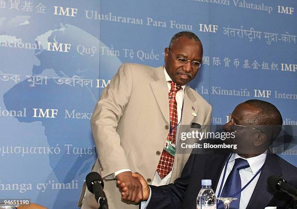 Jean-Claude Masangu Mulongo, Governor of the Central Bank of the Republic of the Congo, left, greets Abdoulaye Diop, Minister of Economy and Finance...