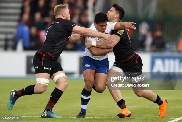 Ben Tapuai of Bath is tackled by Jackson Wray and Sean Maitland during the Aviva Premiership match between Saracens and Bath Rugby at Allianz Park on...