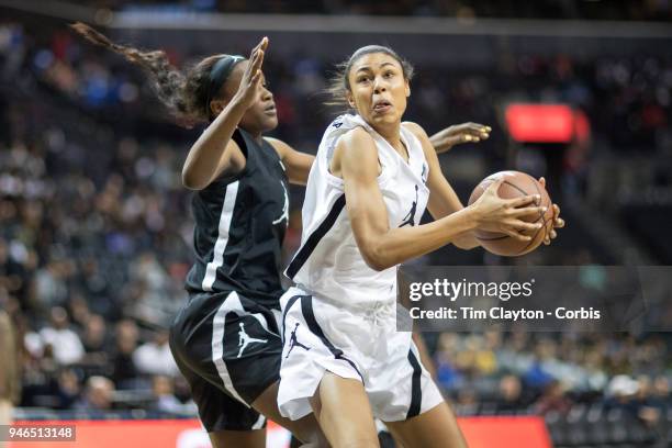 April 08: Olivia Nelson-Ododa Winder-Barrow H.S. Winder, GA drives to the basket defended by Queen Egbo Travis H.S. Richmond, TX during the Jordan...