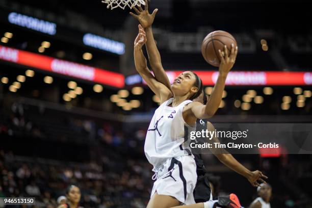 April 08: Olivia Nelson-Ododa Winder-Barrow H.S. Winder, GA drives to the basket defended by Queen Egbo Travis H.S. Richmond, TX during the Jordan...