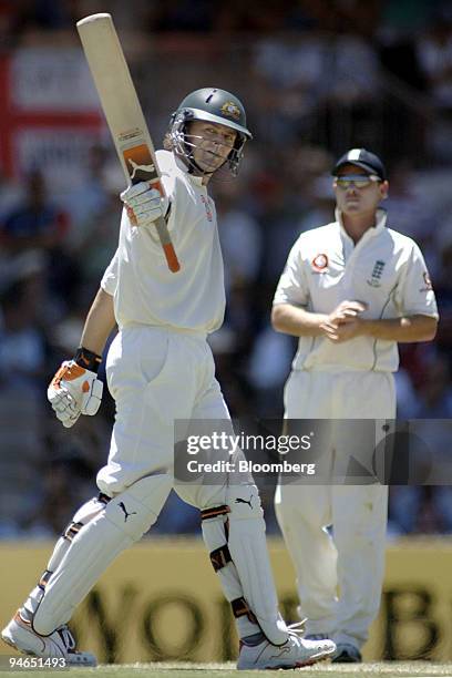 Adam Gilchrist, batting for Australia, salutes the crowd as England fielder Ian Bell, right, looks on during play on day 4 of the second Ashes Test...