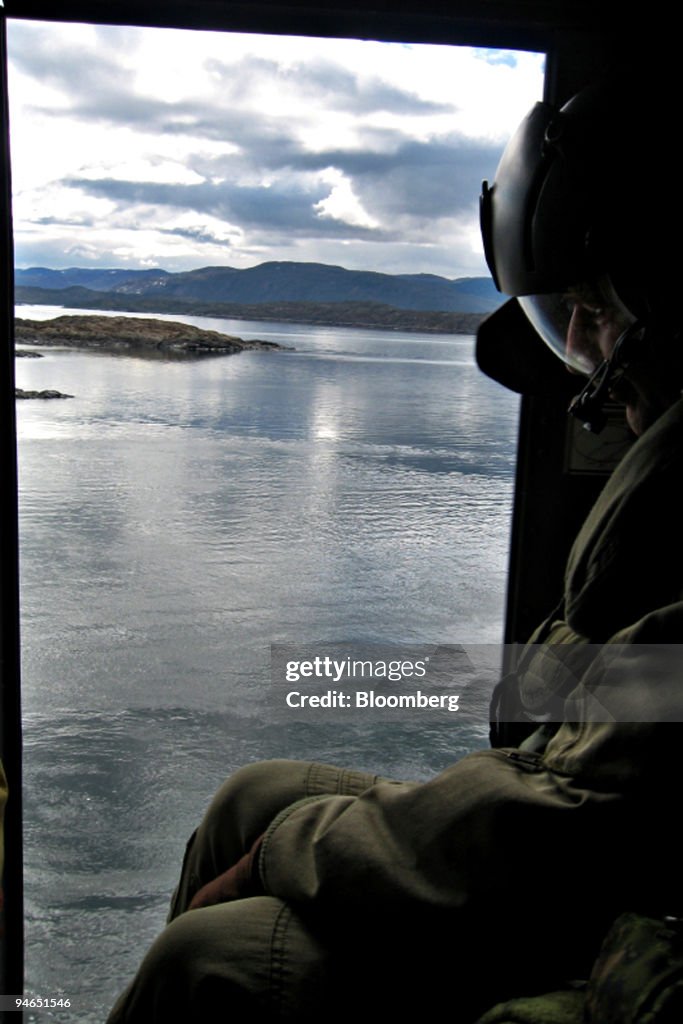 A Canadian Army helicopter flies members of Canada's Joint T