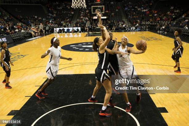 April 08: Charli Collier Barbers Hill H.S. Mont Belvieu, TX drives to the basket defended by Shakira Austin Riverdale Baptist School, Upper Marlboro,...