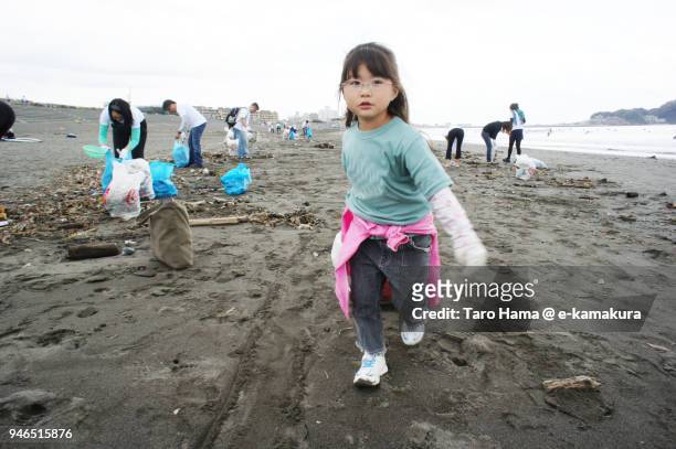 The girl working as a volunteer in Fujisawa in Japan