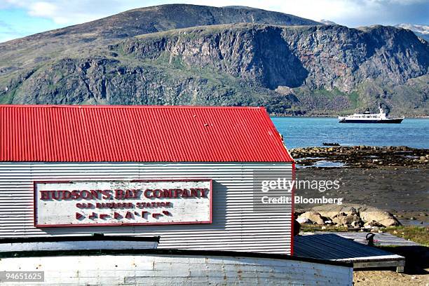 The expedition cruise ship Lyubov Orlova, right, is anchored near an old Hudson's Bay Company whaling station in Pangnirtung, Nunavut, Canada, on...