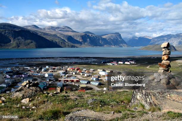 Native Inukshuk, or stone cairn, overlooks the community of Pangnirtung, Nunavut, Canada, on Aug. 19, 2007. While comfortable Caribbean cruises still...