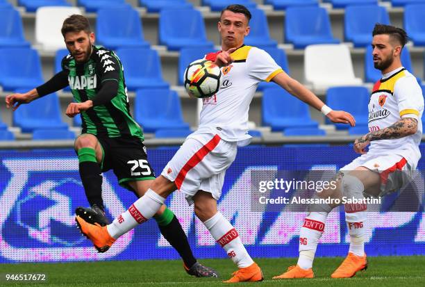 Domenico Berardi of US Sassuolo competes for the ball whit Gaetano Letizia of Benevento Calcio during the serie A match between US Sassuolo and...