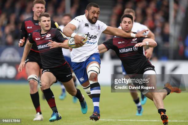 Taulupe Faletau of Bath holds off Sean Maitland during the Aviva Premiership match between Saracens and Bath Rugby at Allianz Park on April 15, 2018...