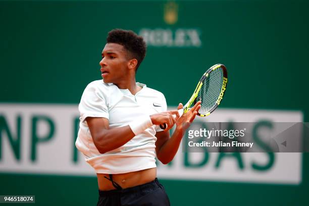 Felix Auger-Aliassime of Canada plays a forehand shot during the Round of 64 match between Mischa Zverev and Felix Auger-Aliassime during Day One of...
