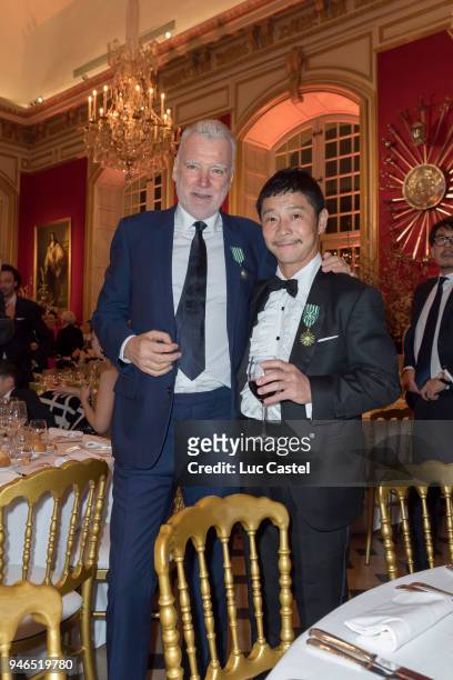 Patrick Seguin poses with Yusaku Maezawa during Yusaku Maezawa & Patrick Seguin Awarded Chevalier Des Arts et Lettres on March 6, 2018 in Paris,...