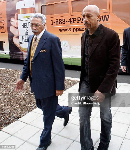 Larry Langford, then Jefferson County Commissioner, left, walks with talk show host Montel Williams at a Partnership for Prescription Assistance...