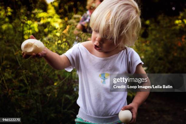 little boy with a broken egg - balin stock pictures, royalty-free photos & images