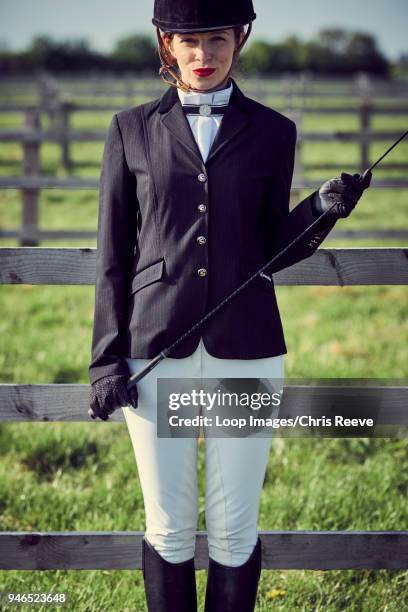 women in equestrian clothing smiling at camera - jodhpur stock pictures, royalty-free photos & images