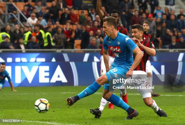 Arkadiusz Milik of SSC Napoli shoots and misses a chance on goal during the serie A match between AC Milan and SSC Napoli at Stadio Giuseppe Meazza...