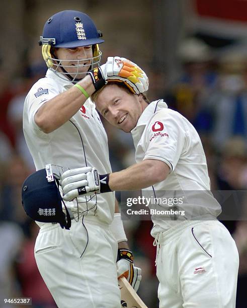 Kevin Pietersen, left, and Paul Collingwood, batting for England, celebrate after Collingwood reached 100 runs on day 2 of the second Ashes Test...