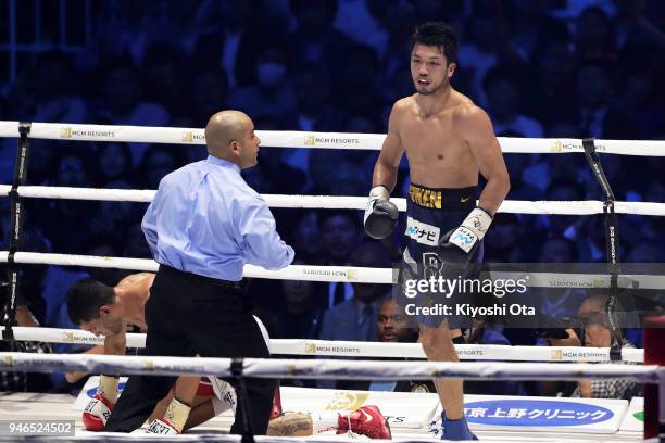 Champion Ryota Murata of Japan reacts after knocking down challenger Emanuele Blandamura of Italy during the WBA Middleweight Title Bout at Yokohama...