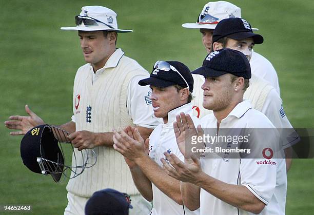 Engalnd players, led by skipper Andrew Flintoff, right, clap as they leave the field, after end of play on day 2 of the second Ashes Test match at...