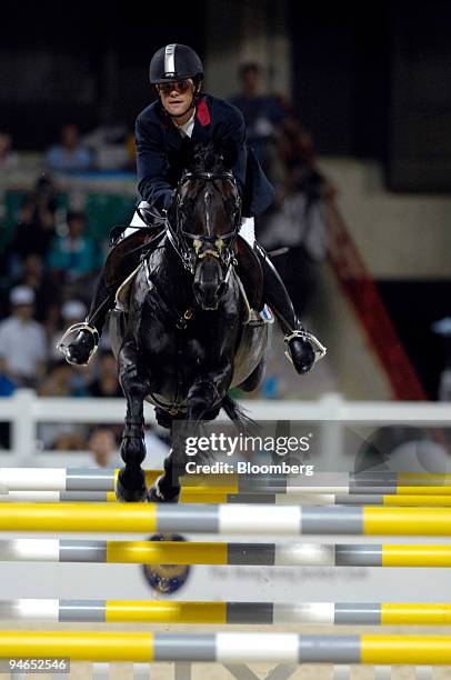 Nicolas Touzaint, of France, rides Liam De La Roche in the jumping event of the Good Luck Beijing HKSAR 10th Anniversary Cup Equestrian competition...