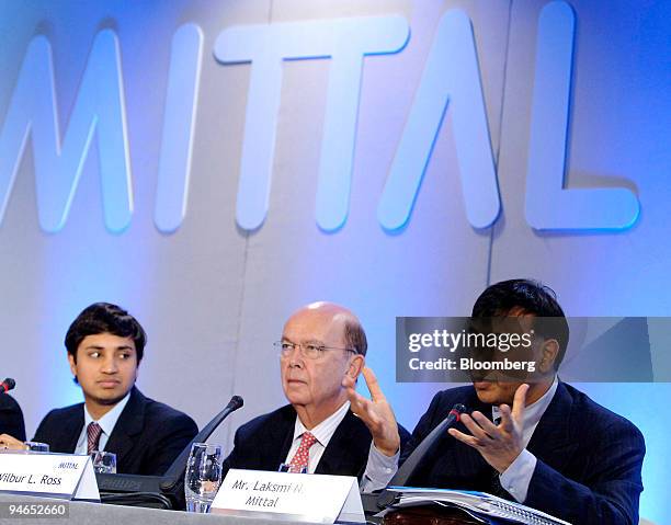 Aditya Mittal, left, Mittal Steel Co. Chief financial officer and president and Wilbur L. Ross, center, Mittal Steel board member listen as Lakshmi...