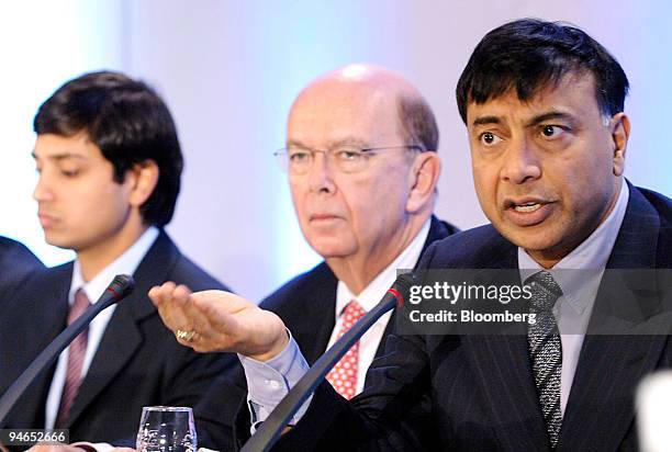 Aditya Mittal, left, Mittal Steel Co. Chief financial officer and president and Wilbur L. Ross, center, Mittal Steel board member listen as Lakshmi...