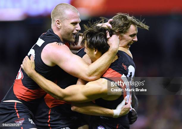 Mark Baguley of the Bombers celebrates a goal with Joe Daniher ,Jake Stringer and Anthony McDonald-Tipungwuti of the Bombers during the round four...