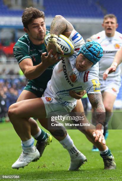 Jack Nowell of Exeter Chiefs is tackled by Tom Fowlie of London Irish during the Aviva Premiership match between London Irish and Exeter Chiefs at...