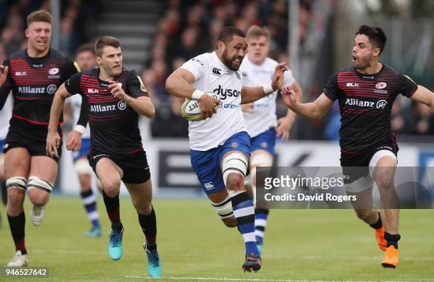 Taulupe Faletau of Bath holds off Sean Maitland during the Aviva Premiership match between Saracens and Bath Rugby at Allianz Park on April 15, 2018...