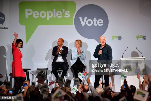 Liberal Democrat MP Layla Moran waves as she joins Labour Party MP Chuka Umunna , Conservative MP Anna Soubry and comedian Andy Parsons on stage...