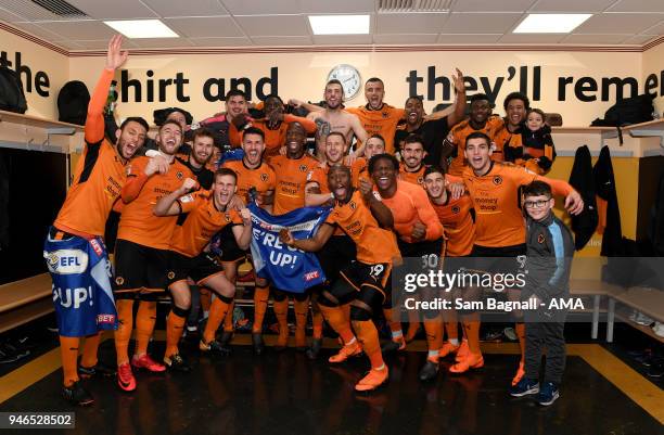 Players of Wolverhampton Wanderers celebrate promotion to the Premier League during the Sky Bet Championship match between Wolverhampton Wanderers...