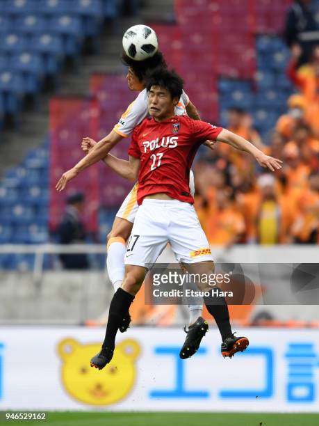 Daiki Hashioka of Urawa Red Diamonds and Ko Matsubara of Shimizu S-Pulse compete for the ball during the J.League J1 match between Urawa Red Diamonds...