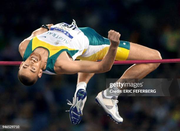 Australia's Tim Forsyth clears the bar during the qualifying round of the high jump competition of the 2000 Summer Olympics in Sydney 22 September...