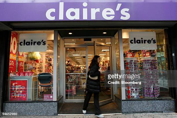 Woman exits a Claire's store on Friday, December 1, 2006 in New York. Claire's Stores Inc., the retailer of jewelry for teens, said it hired Goldman...