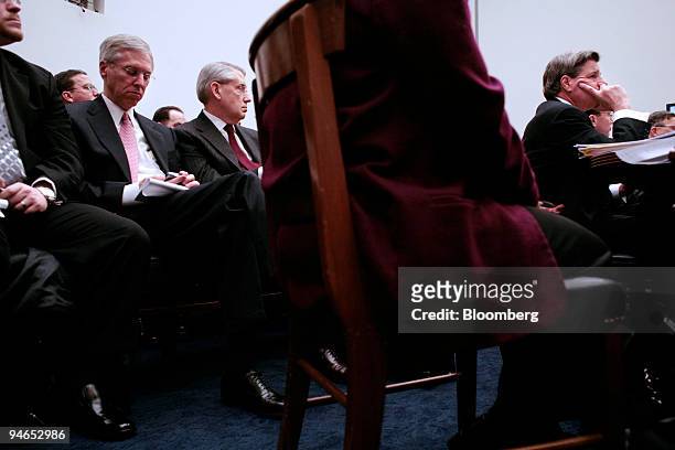 Paul Bremer, right, former Ambassadorof the Coalition Provisional Authority, testifies before a House Oversight and Government Reform Committee in...