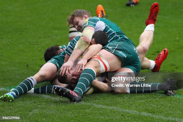 Sam Simmons of Exeter Chiefs flights his way over the try line to score during the Aviva Premiership match between London Irish and Exeter Chiefs at...