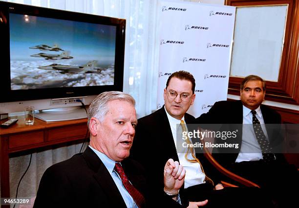 Mark E. Kronenberg, left, vice president of business development for Integrated Defense Systems at Boeing Asia Pacific, Dan Korte, center, vice...