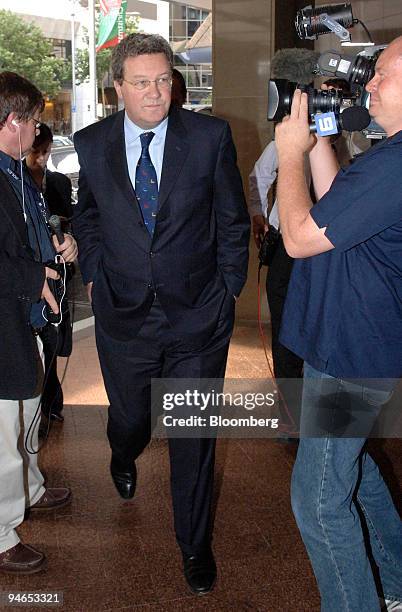 Alexander Downer, Australia's minister of foreign affairs, center, arrives for a meeting of foreign ministers from the Pacific Islands Forum, a group...