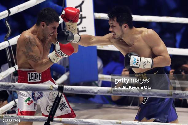 Champion Ryota Murata of Japan punches challenger Emanuele Blandamura of Italy during the WBA Middleweight Title Bout at Yokohama Arena on April 15,...